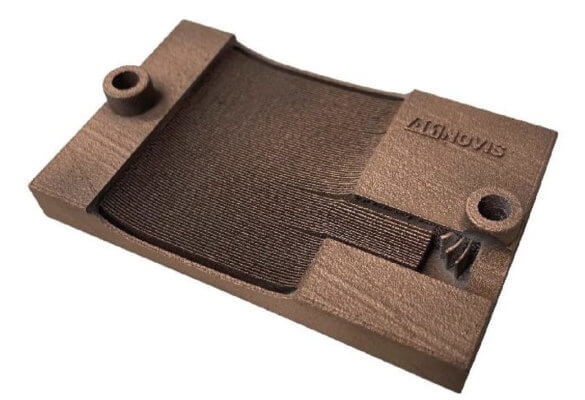 3D-gedrucktes Teil aus Kupfer mit Logo von Amnovis