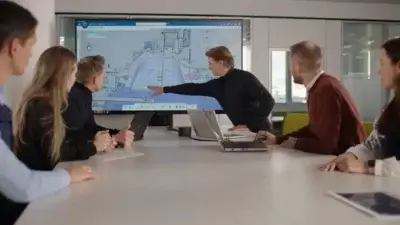 BMW Group Mitarbeiter arbeiten an 3DEXPERIENCE Plattform zur Optimierung des Fahrzeugentwicklungsprozesses Team der BMW Group bei der Entwicklung eines Fahrzeugs mit Dassault Systèmes 3DEXPERIENCE Software