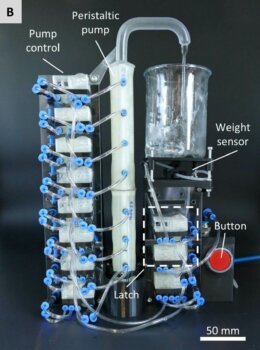 Testaufbau mit 3D-gedruckten pneumatischen Logikmodulen zur Bewegungssteuerung eines Getränkespenders per Luftdruck