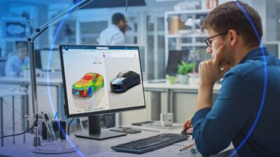 Digitale Fahrzeugentwicklung mit der 3DEXPERIENCE Plattform und virtuellen Zwillingen. Ingenieur arbeitet am Computer mit digitaler Fahrzeug-Simulation auf der 3DEXPERIENCE Plattform.