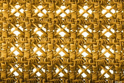 Mikrostruktur eines MIT-Metamaterials aus dem 3D-Druck mit Spiral- und Gitterelementen Detailansicht der gedruckten Mikrostruktur eines Metamaterials mit spiralförmiger und starrer Gitterstruktur vom MIT