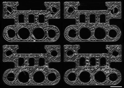 Vier 3D-gedruckte Kunststoffbauteile mit maschinenspezifischen Oberflächenstrukturen zur Rückverfolgung mittels KI-Modell
